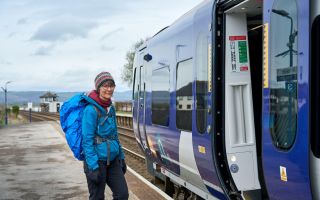 Walker boarding a train at Arnside Wildey Media