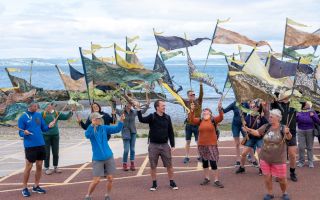 Walkers parading their pennants in Morecambe Bay Lines T Bunney