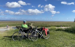 Cyclist enjoying the view Bay Cycle Way by Jo